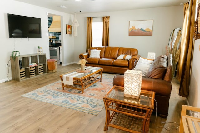 living room with light hardwood / wood-style flooring