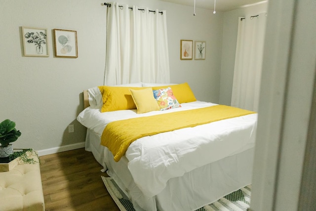 bedroom featuring dark wood-type flooring