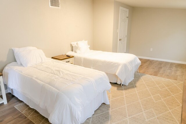 bedroom with wood-type flooring