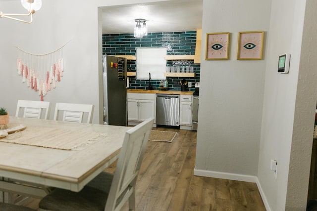 dining area with hardwood / wood-style flooring