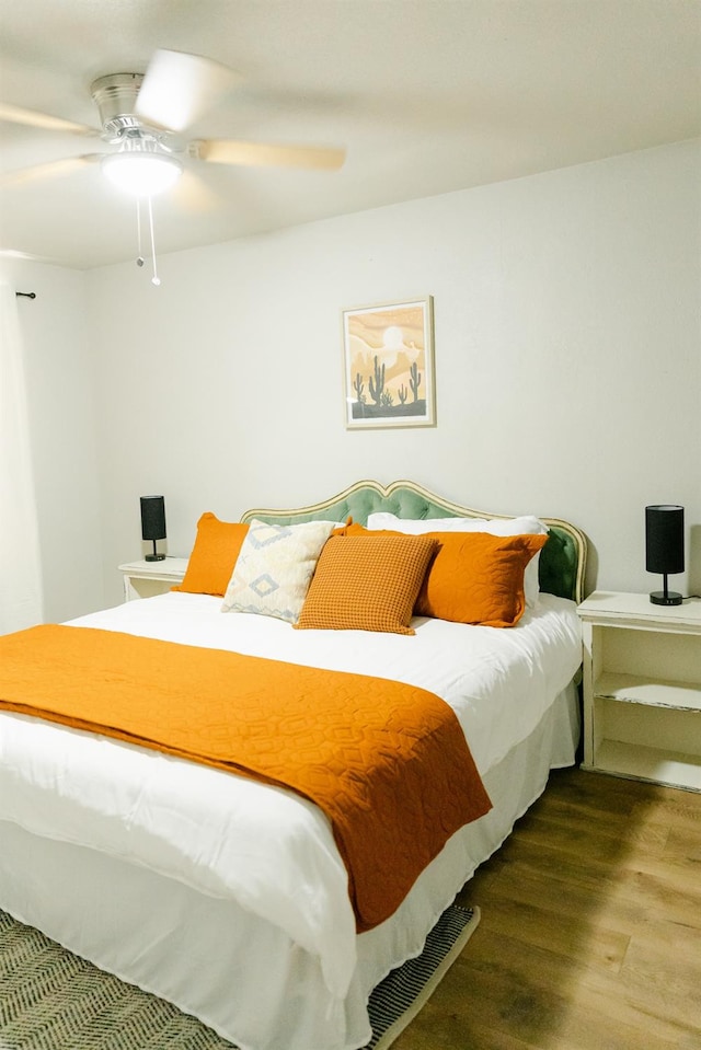 bedroom with hardwood / wood-style flooring and ceiling fan