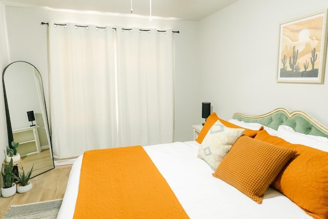 bedroom featuring hardwood / wood-style floors