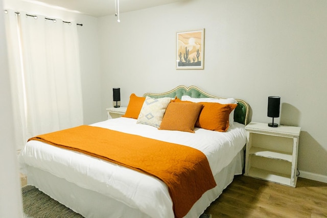 bedroom featuring hardwood / wood-style flooring