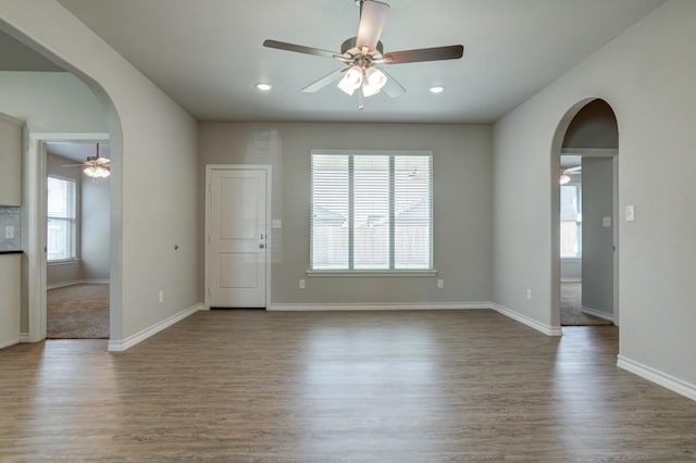 unfurnished room with wood-type flooring and ceiling fan