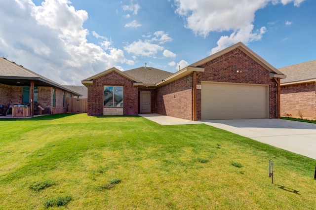 view of front of house featuring a garage and a front yard