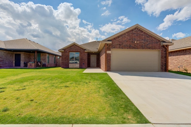 view of front of property featuring a garage and a front lawn