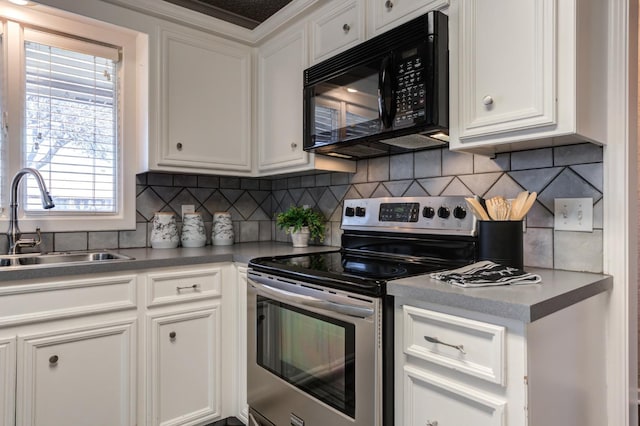 kitchen with white cabinetry and electric range