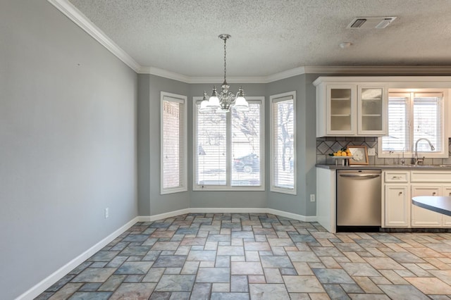 kitchen featuring white cabinetry, stainless steel dishwasher, a chandelier, and sink