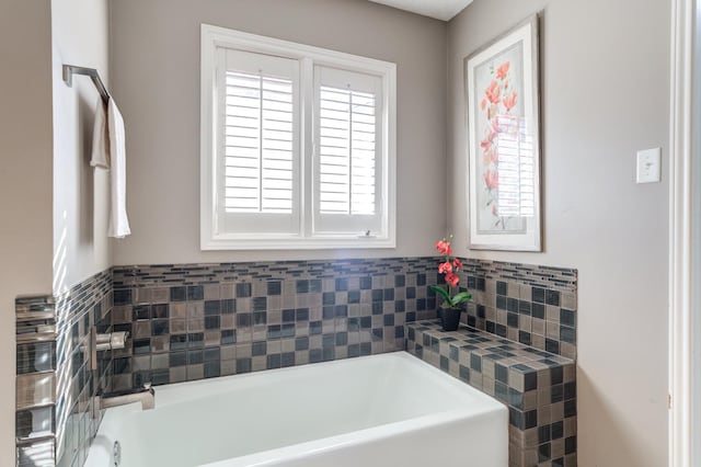 bathroom featuring a washtub