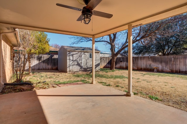 view of patio / terrace with ceiling fan and a storage shed