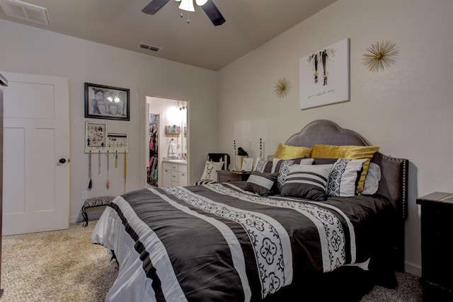 bedroom with carpet, visible vents, vaulted ceiling, and a ceiling fan