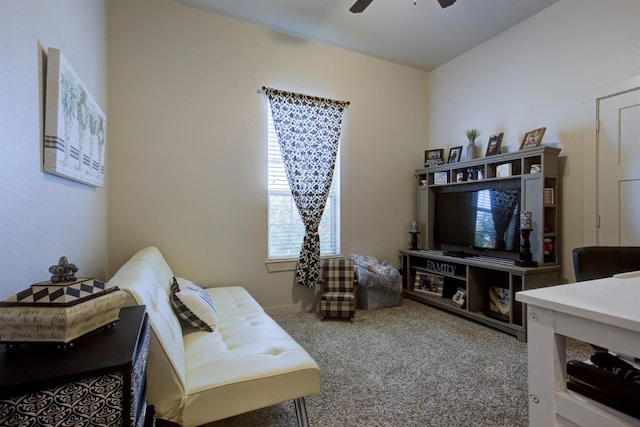 carpeted living room featuring a ceiling fan