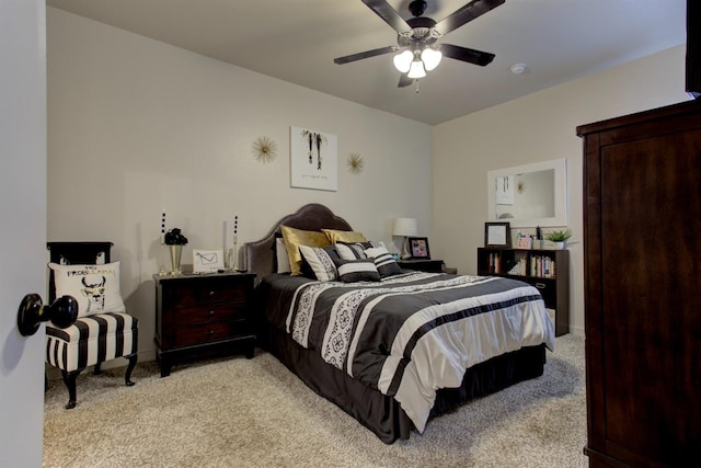 bedroom with ceiling fan and light colored carpet