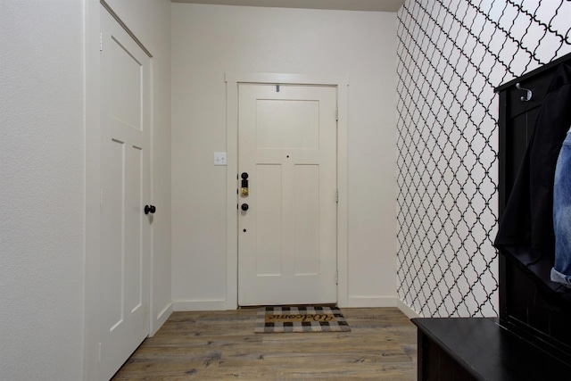 interior space featuring wood finished floors and baseboards