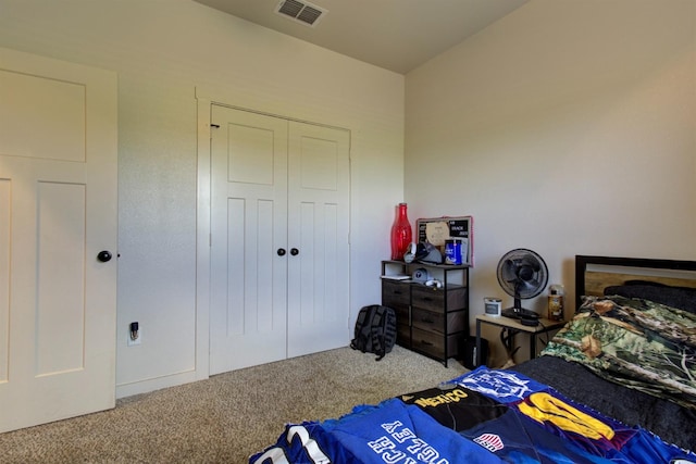 bedroom with carpet, a closet, and visible vents