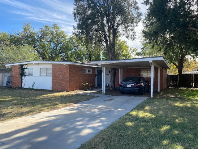 single story home with a carport and a front lawn