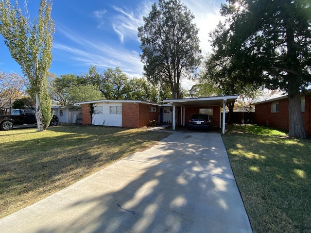 single story home with a front yard and a carport