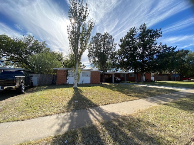 ranch-style home with a front yard