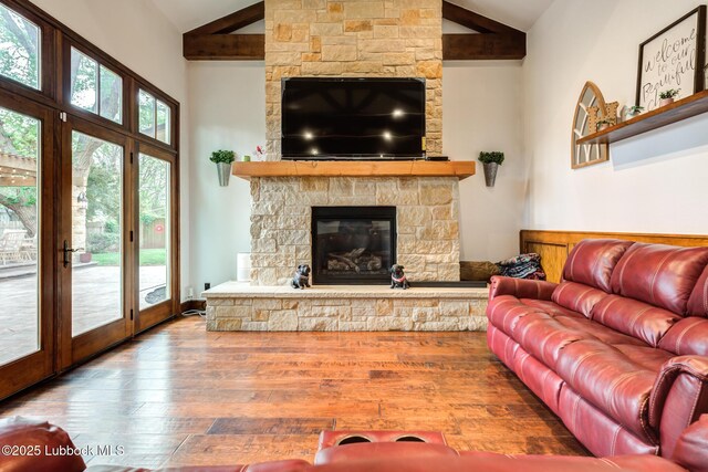 4510 21st St, Lubbock, TX 79407 - living area featuring high vaulted ceiling, hardwood / wood-style floors, a fireplace, and beamed ceiling