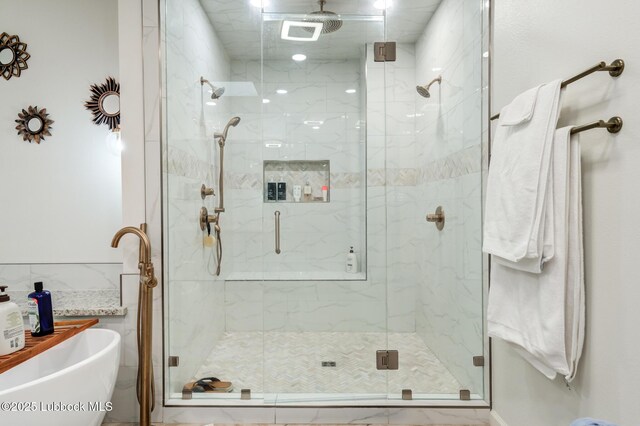 4510 21st St, Lubbock, TX 79407 - full bathroom featuring a marble finish shower and a soaking tub