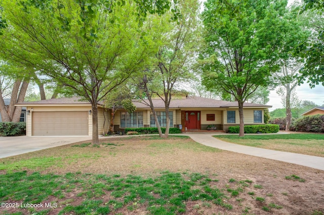 4510 21st St, Lubbock, TX 79407 - ranch-style home with an attached garage, concrete driveway, a front lawn, and covered porch