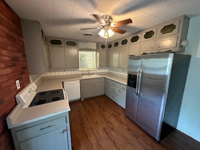 kitchen featuring white cabinetry, sink, dark hardwood / wood-style flooring, ceiling fan, and white appliances