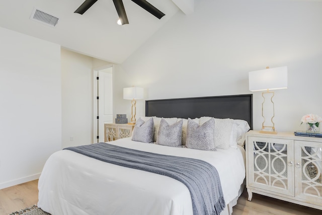 bedroom featuring ceiling fan, high vaulted ceiling, and light wood-type flooring