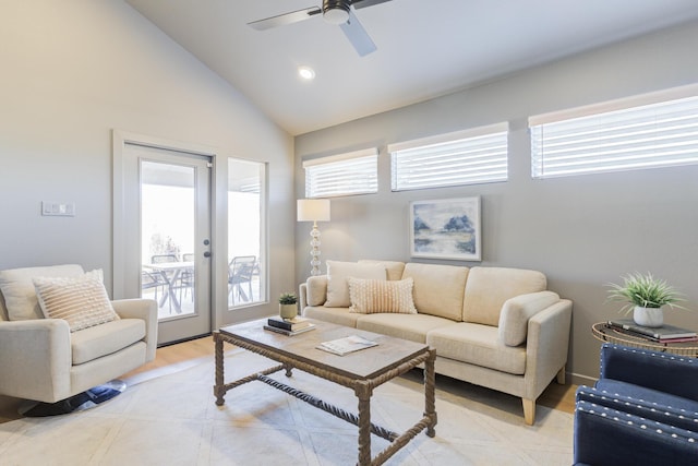 living room featuring vaulted ceiling, plenty of natural light, ceiling fan, and light hardwood / wood-style floors