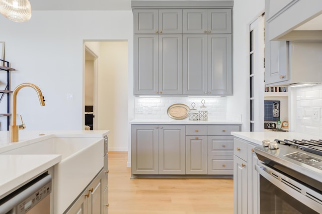 kitchen with stainless steel appliances and gray cabinets