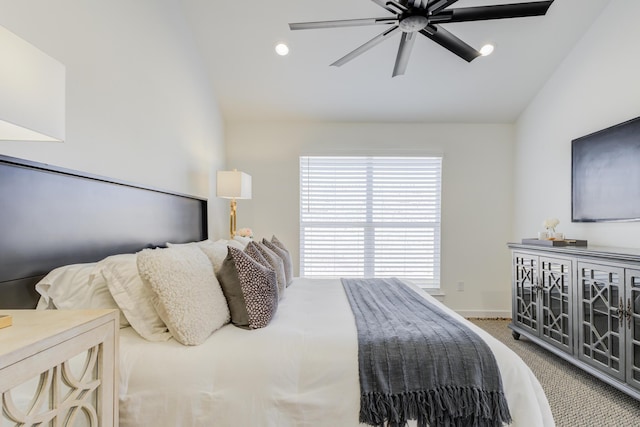 bedroom featuring ceiling fan, carpet flooring, and vaulted ceiling