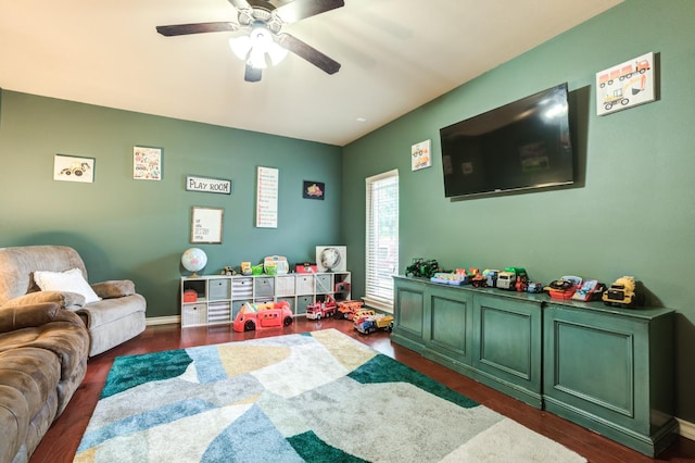 game room with dark hardwood / wood-style floors and ceiling fan