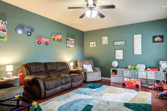 game room featuring ceiling fan and dark hardwood / wood-style flooring