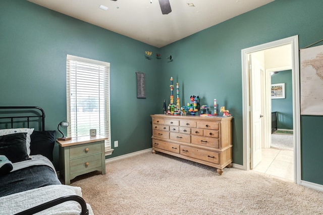 bedroom featuring light carpet and ceiling fan