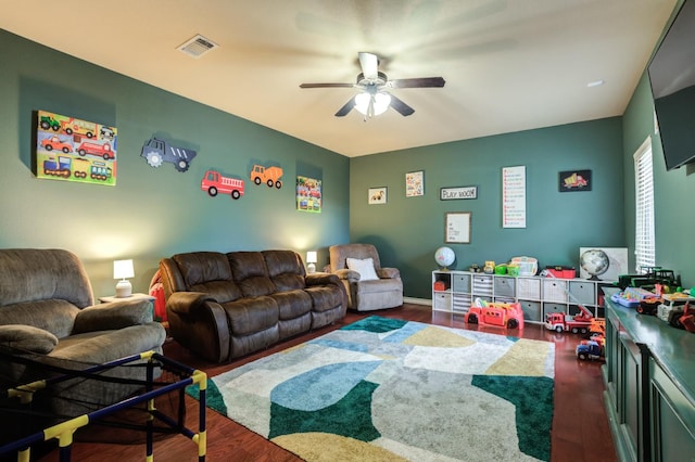 game room featuring ceiling fan and dark hardwood / wood-style floors