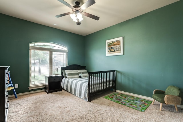 carpeted bedroom featuring ceiling fan