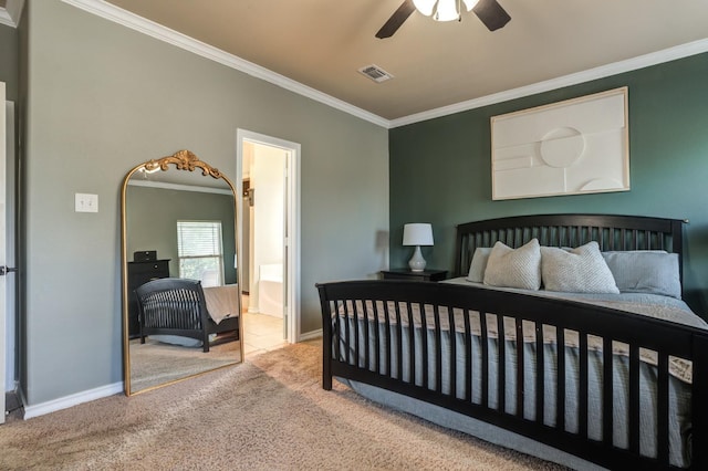 bedroom featuring ornamental molding, carpet, ensuite bathroom, and ceiling fan