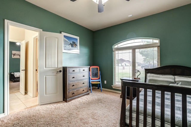 carpeted bedroom featuring ceiling fan