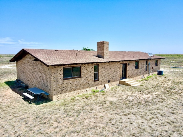 rear view of property with central air condition unit