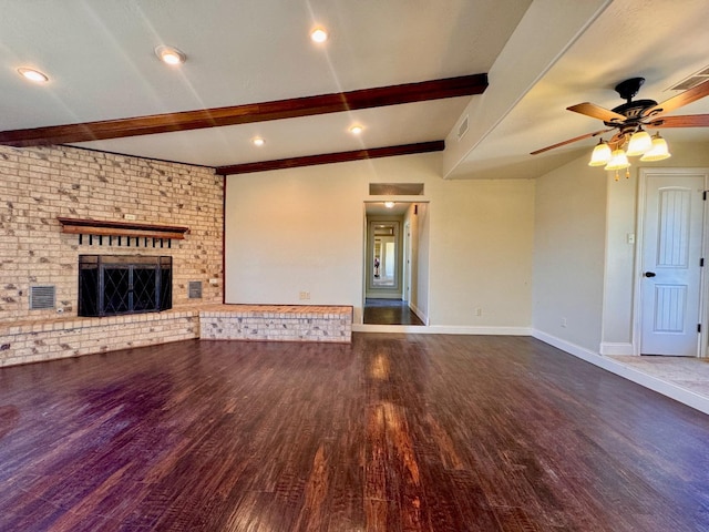 unfurnished living room featuring dark hardwood / wood-style floors, ceiling fan, a fireplace, and vaulted ceiling with beams