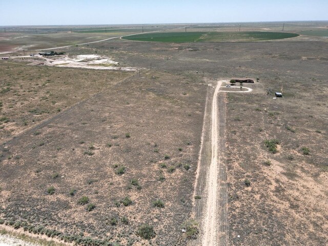 birds eye view of property with a rural view