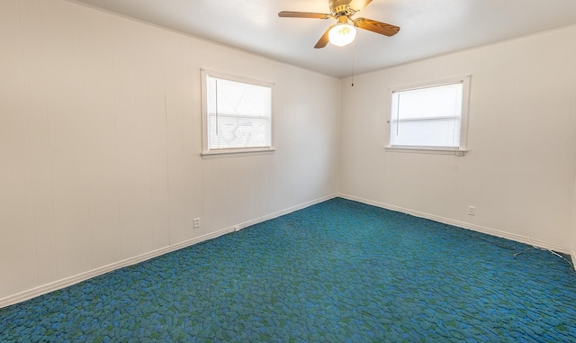 empty room featuring carpet floors and ceiling fan