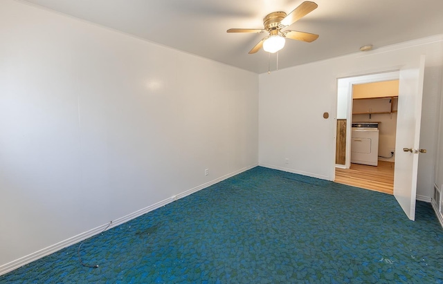 empty room featuring washer / dryer, carpet flooring, and ceiling fan