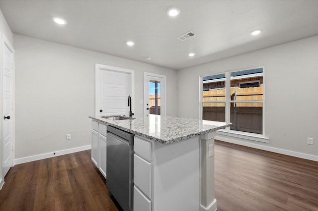 kitchen with sink, dishwasher, white cabinetry, dark hardwood / wood-style floors, and an island with sink