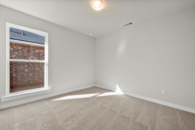 unfurnished room featuring carpet floors