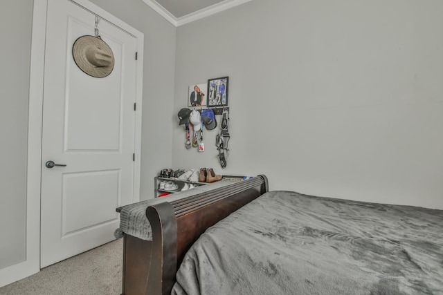 carpeted bedroom featuring crown molding