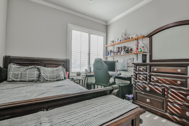 bedroom with ornamental molding and carpet flooring