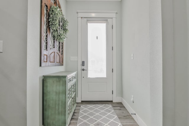 doorway to outside featuring light hardwood / wood-style floors