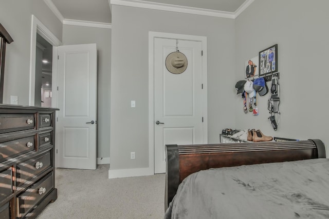 bedroom with crown molding and light colored carpet