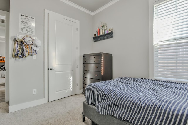 bedroom with crown molding and light carpet