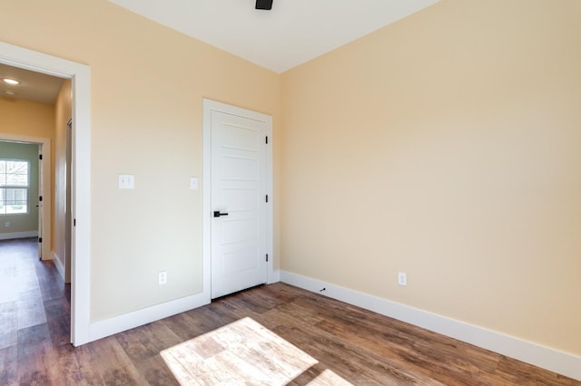 empty room with wood-type flooring and ceiling fan